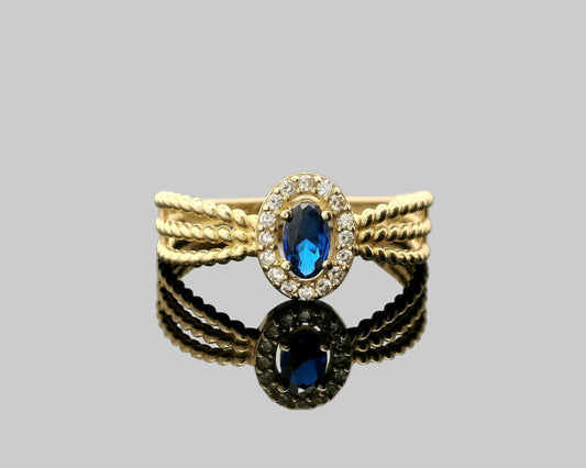 ANILLO TRES HILERAS PIEDRA EN EL CENTRO 14K